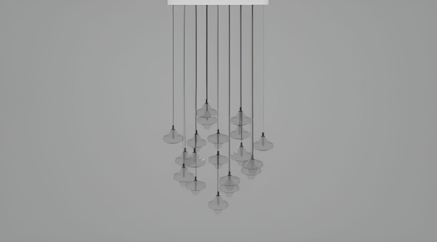 The Starcloud C19A by Brokis displays handblown, sculptural pendants in a luminous cluster, suspended on sleek black flexes.