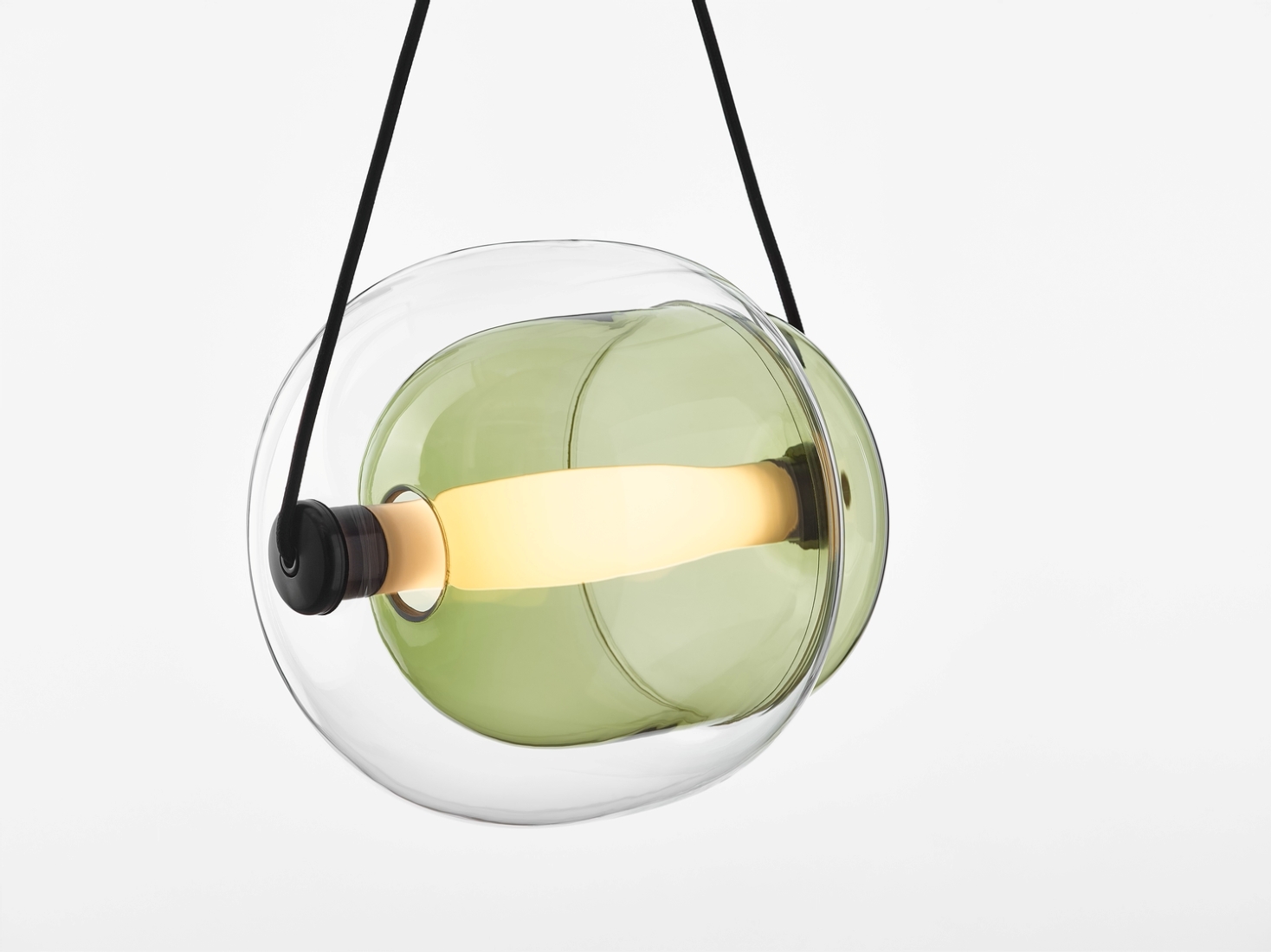 Brokis Capsula Single Pendant with a cylindrical LED, nestles in green glass, encased by a clear, sculptural bubble shell.