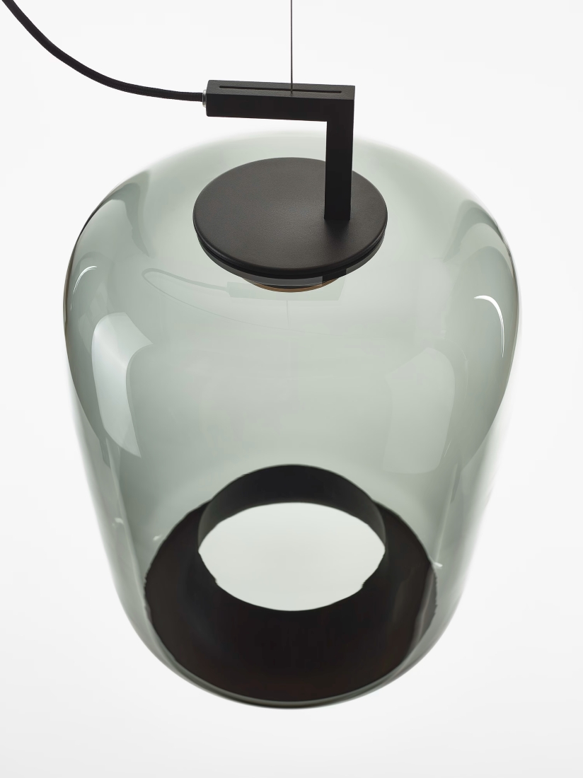A Brokis Double Long Pendant with a grey glass dome, black ring detail, and sculptural base.