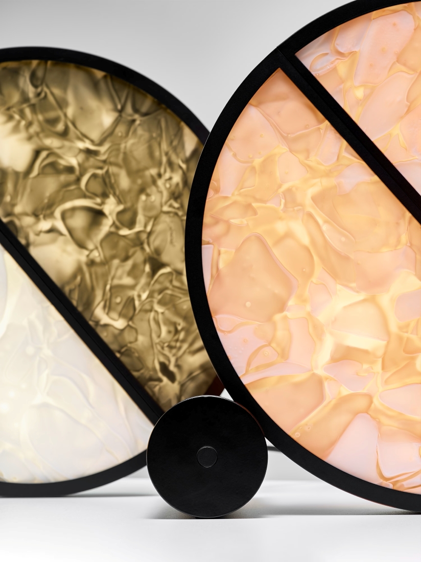Brokis Geometric Table lamps with black rims, brown and prink BROKISGLASS panels, overlap atop black bases.