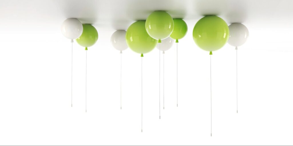 Glossy green and white Brokis Memory lights with strings on a white ceiling, creating a minimal, and modern ambience.