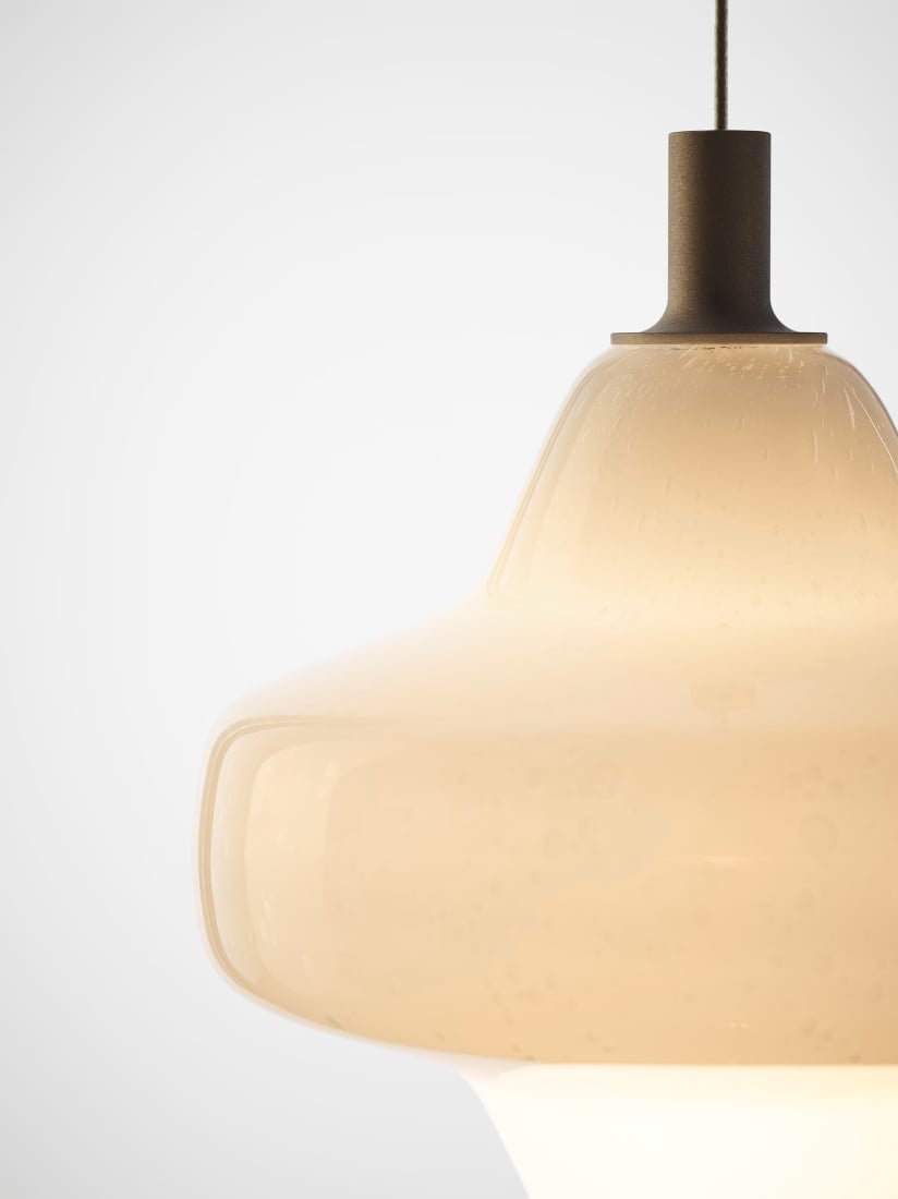 A close-up of Brokis Starcloud Lyra Pendant in opaline handblown glass, suspended on a slim cord, luxe minimalist style.