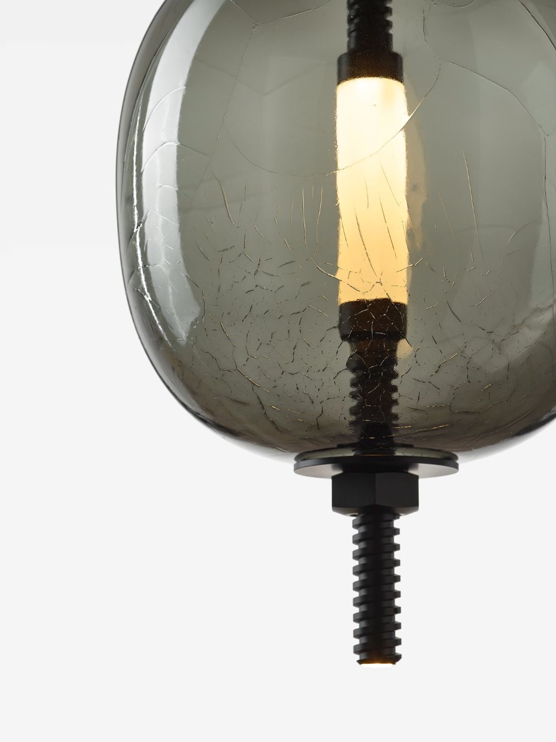 Brokis Under Pressure More light with a hand-blown, crackled glass shade and cylindrical bulb, suspended by matte black rod.