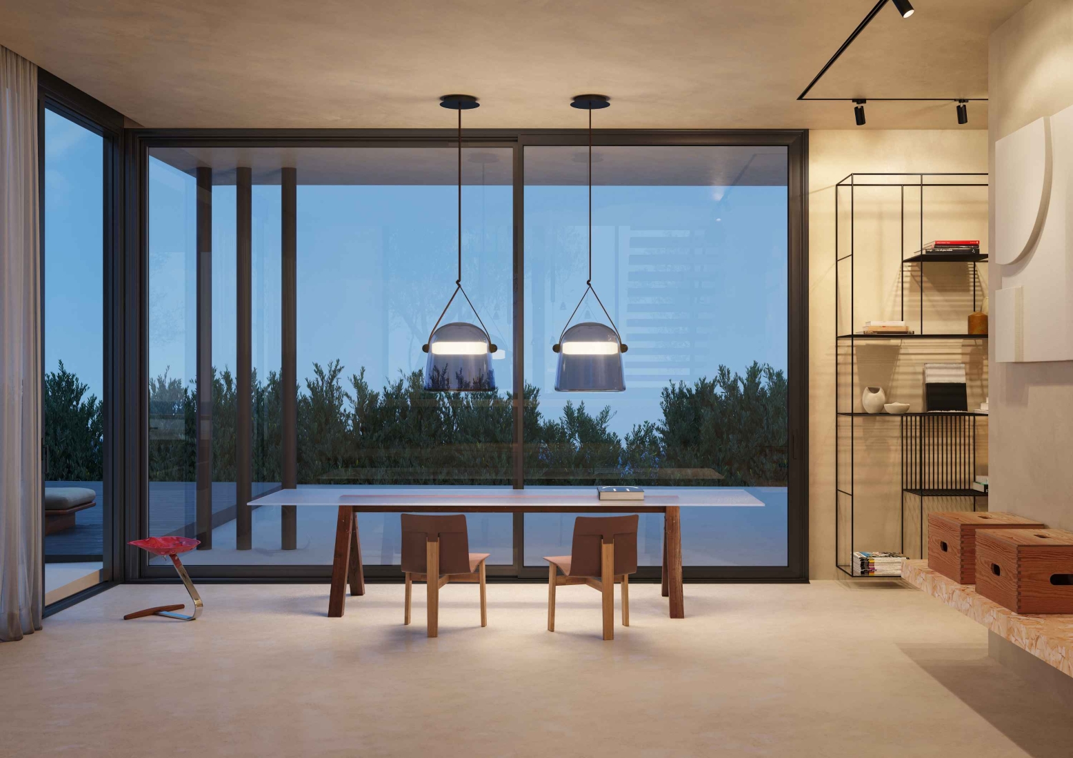 A minimalist room with two wooden chairs, Brokis Mona Pendants, and glass walls framing lush greenery.