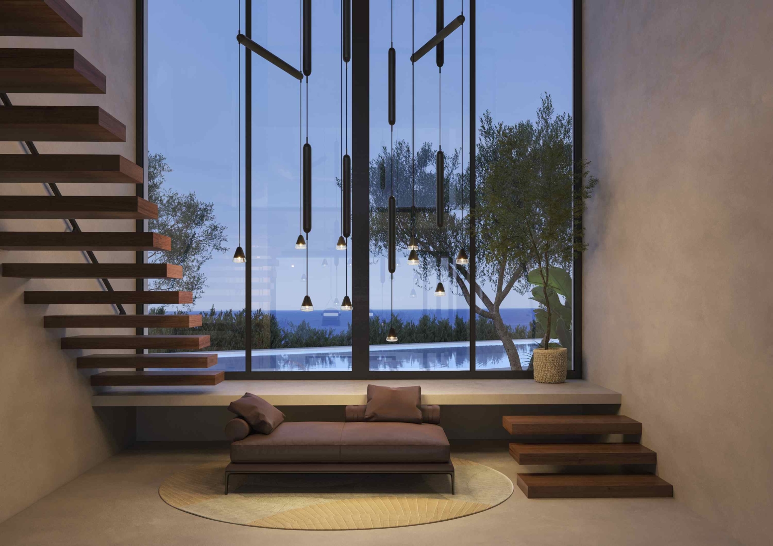 An elegant room with a sculptural handblown Brokis Puro pendants softly illuminating a luxe sofa and floating staircase.