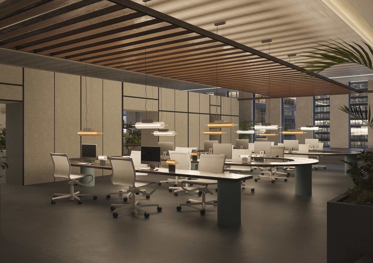 A modern, open-plan office features curved desks, white swivel chairs, Brokis Overlay chandeliers, and lush green plants.