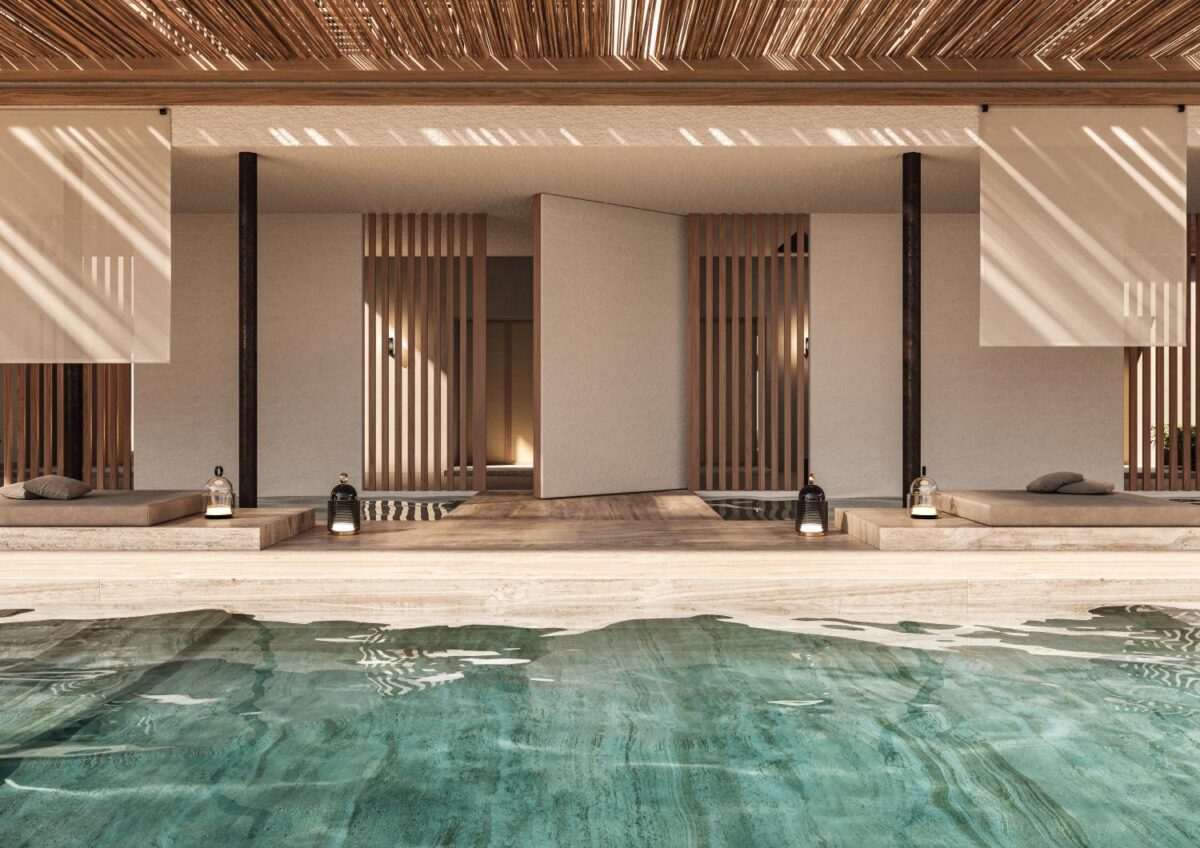 Open-air minimalist spa with a turquoise pool, cushioned lounger beds, Brokis Dome Nomad lanterns, and sunlit pergola.