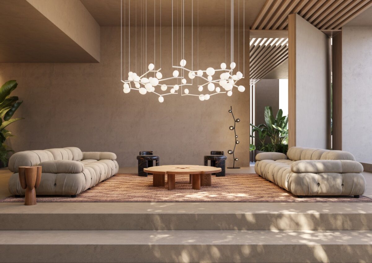 Spacious lounge with beige walls, tufted grey sofas, wooden hexagonal table, Brokis Ivy Horizontal, and garden views.