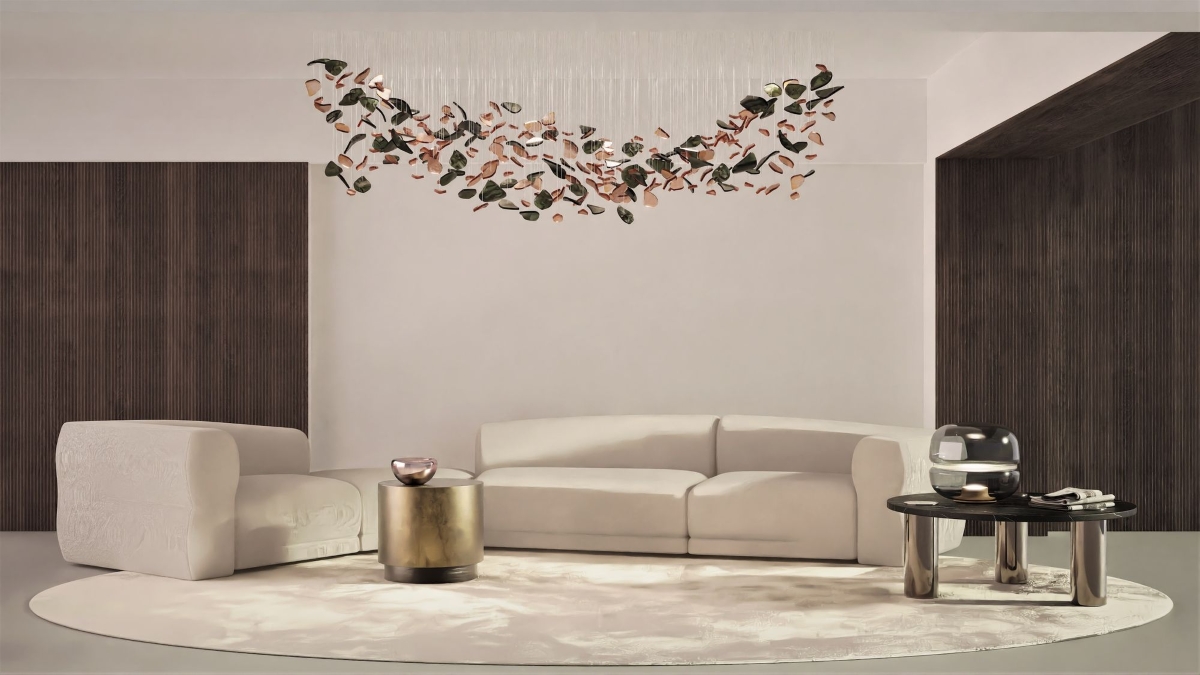 A modern living room with cream curved sofas, a circular beige rug, and a BROKISGLASS Bloom Rectangular Cloud chandelier.