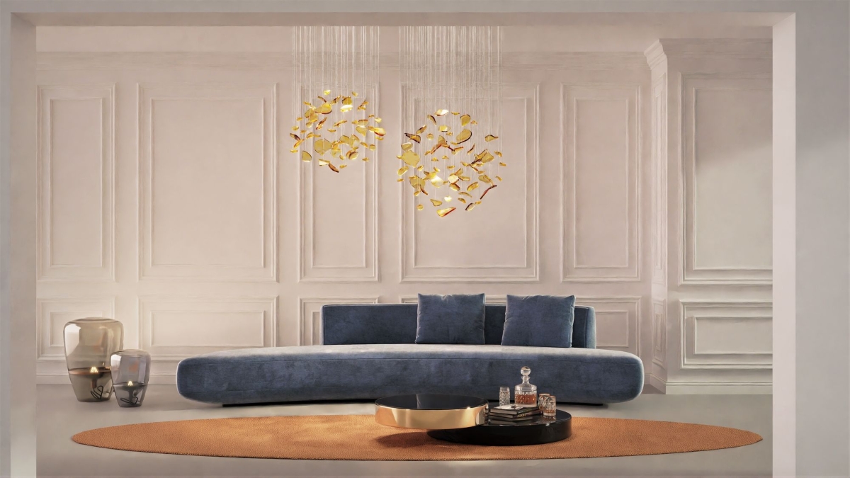 A living room with a long sofa, BROKISGLASS Bloom Round Double chandelier above a chic coffee table, and an elegant oval rug.