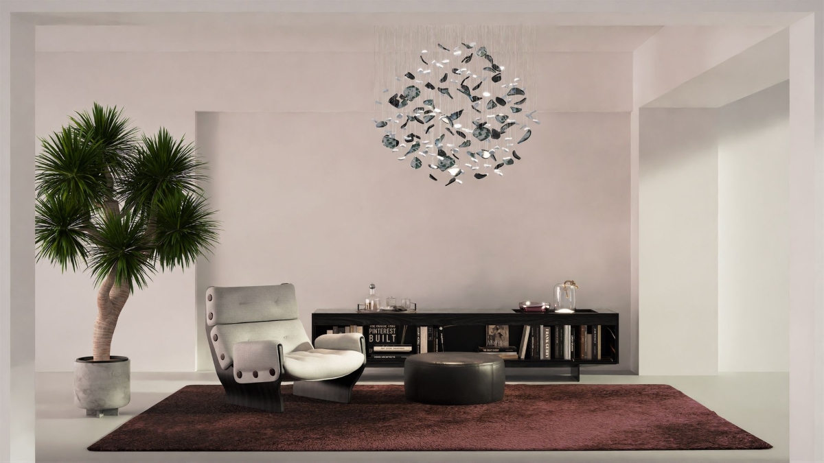A living room with a large potted palm and grey lounge chair, anchored by a mauve rug and BROKISGLASS Bloom Round Sphere.