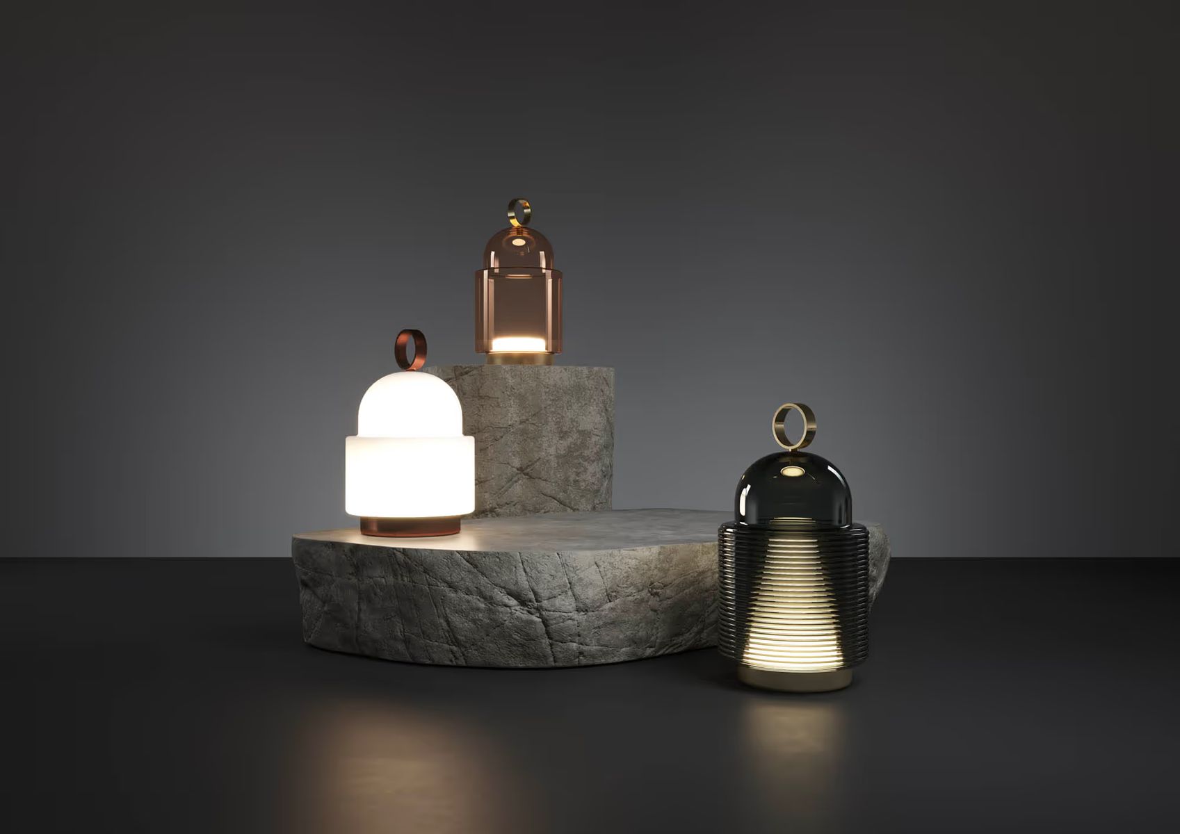 Brokis Dome Nomad lanterns in varying finishes emit a warm glow atop textured stone plinths, exuding luxury.
