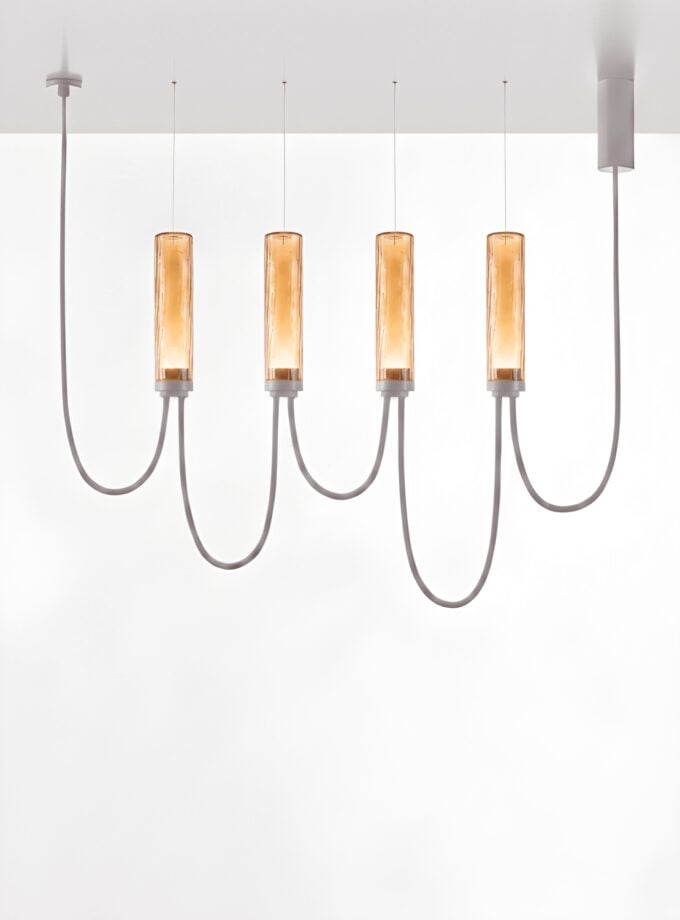 Brokis Arcade IV in amber glass with ripples and glossy white finish.