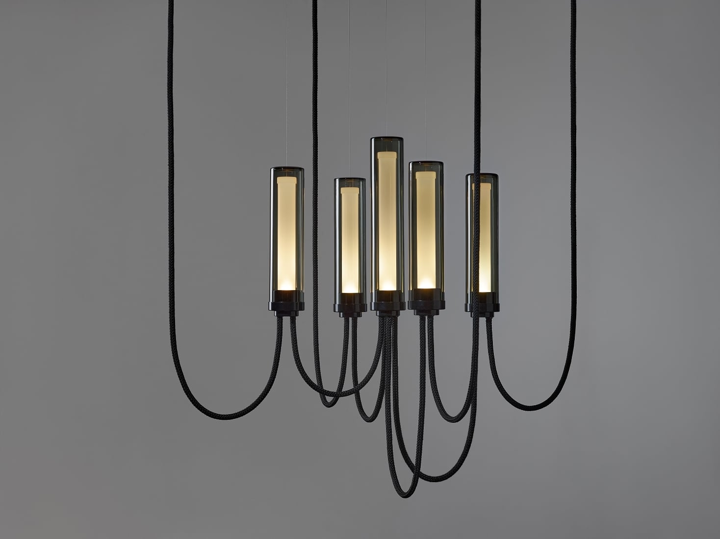 brokis-collections_arcade_criss-cross-v-small-in-smoke-grey-glass-and-glossy-black-finish-with-dark-background