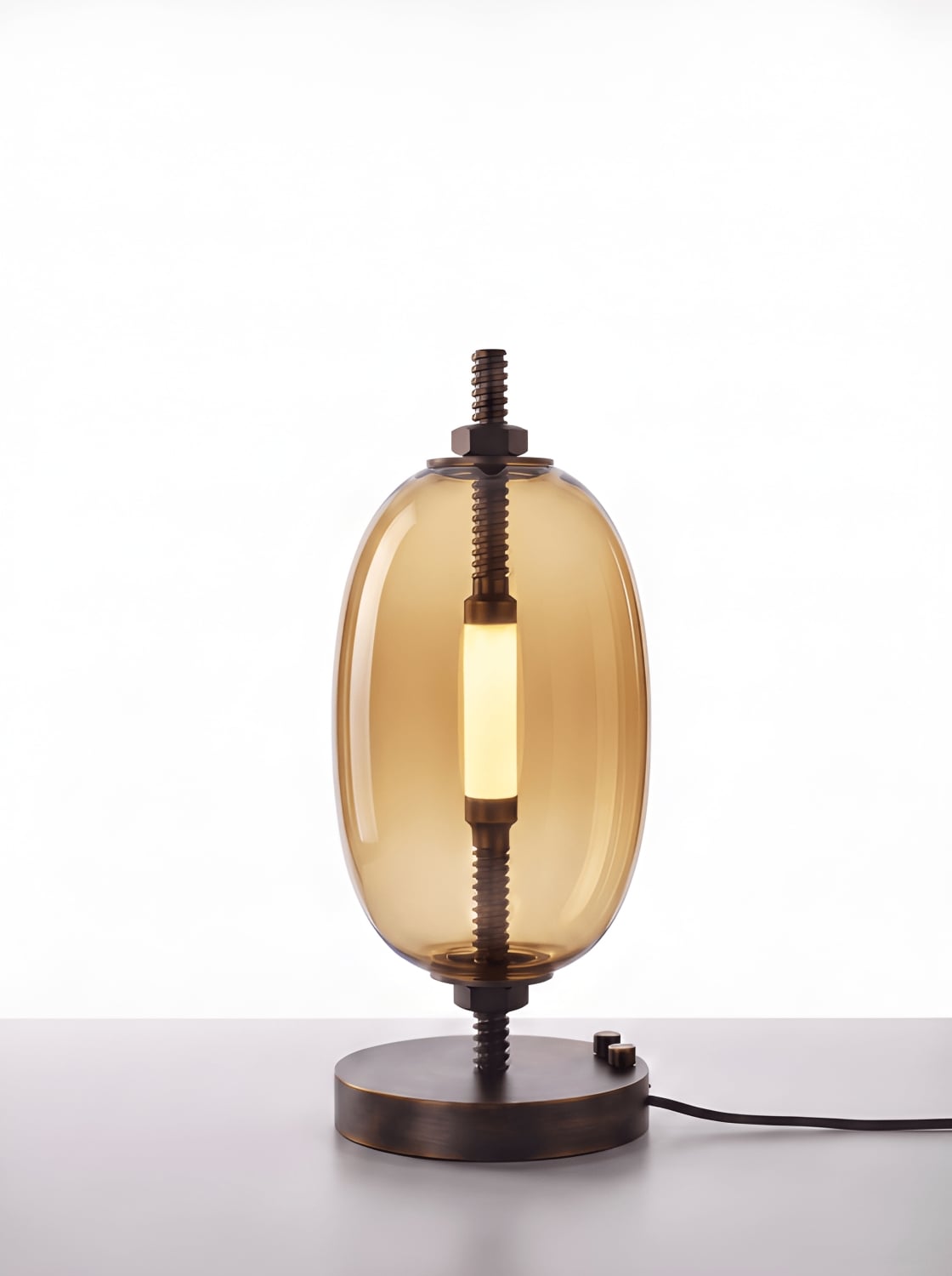 Brokis Under Pressure Table Little in smoke brown glass and bronze finish.